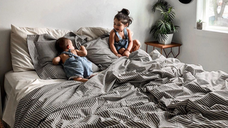 A cozy, farmhouse-inspired bedroom with Red Land Cotton bedding and rustic touches, offering a guide to achieving the perfect farmhouse style