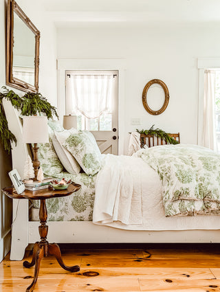 A beautifully styled bed with layered Red Land Cotton bedding, demonstrating how to create a designer-inspired look with perfect combinations of sheets, blankets, and throws