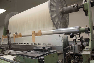 Red Land Cotton workers at the manufacturing plant, producing high-quality cotton towels, showcasing the latest production processes for 2024.
